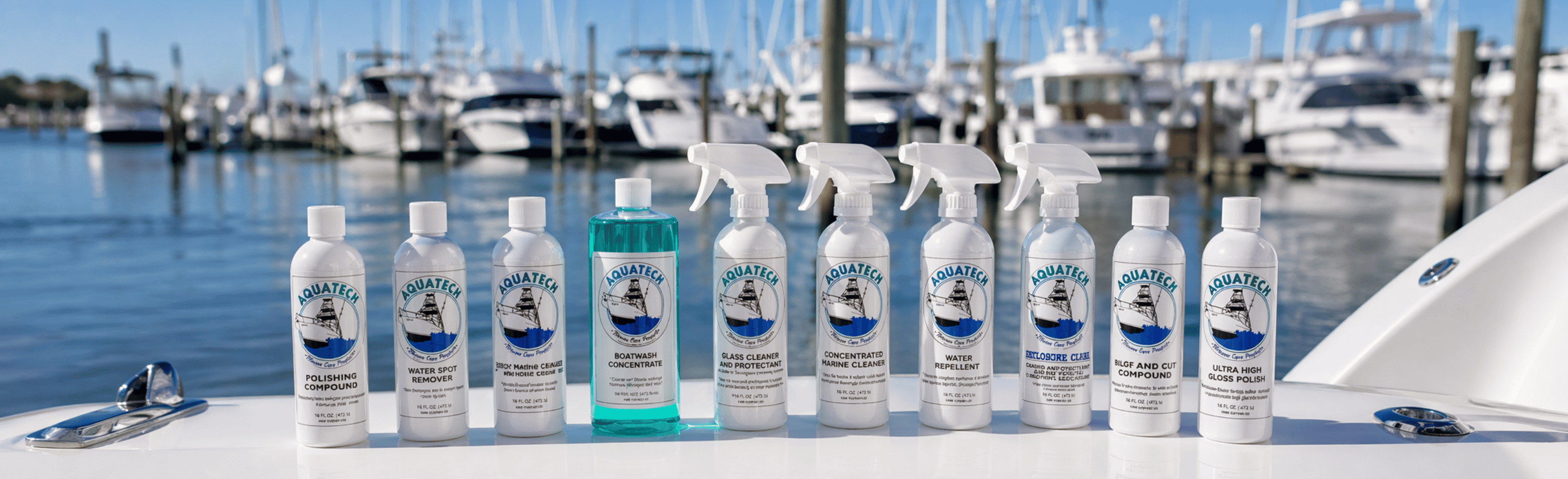The complete Aquatech marine care product lineup arranged on a boat deck
